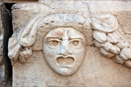 Human head stone decorations in Aphrodisias (Turkey) build during Hellenistic and Roman period. In Roman time it was a small city in Caria.のeditorial素材