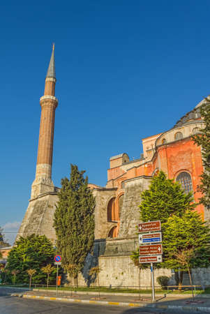 Minaret detail of Hagia Sophia is a former Orthodox patriarchal basilica, later a mosque, and now a museum in Istanbul. East view. Tourist signs in the front.のeditorial素材