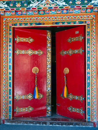 Red door - detail at the library entrance of the Tibetan monastery  Refugee home, Dharamsala northern India の写真素材
