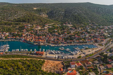 Helicopter aerial shoot of marina with boats and sailboats, Adriatic tourist destination near Trogir, Croatiaの写真素材