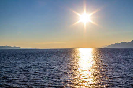 Sunset on the open sea in Dubrovnik archipelago near island Mljet, Croatia.の写真素材