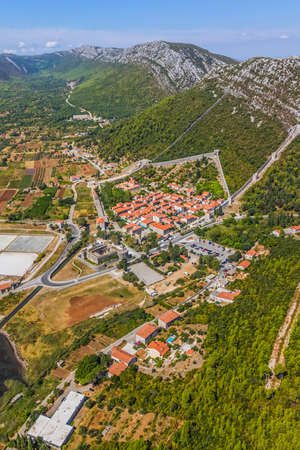 Aerial helicopter photo of medieval town Ston, famous second world largest stone wall and saltern, Peljesac peninsula near Dubrovnik, Croatia.の写真素材