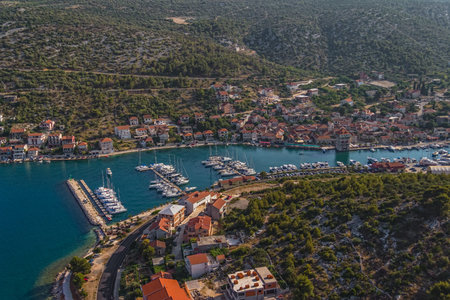 Helicopter aerial shoot of marina with boats and sailboats, Adriatic tourist destination near...