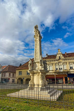 Votive column from baroque perion in Pozega main square, Croatia.のeditorial素材