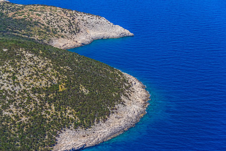 Island Losinj rocky coast in Adria sea - aerial viewの写真素材