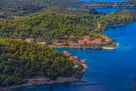 Aerial helicopter shoot of National park on island Mljet, village Pomena, Dubrovnik archipelago, Croatia. The oldest pine forest in Europe preserved.の写真素材