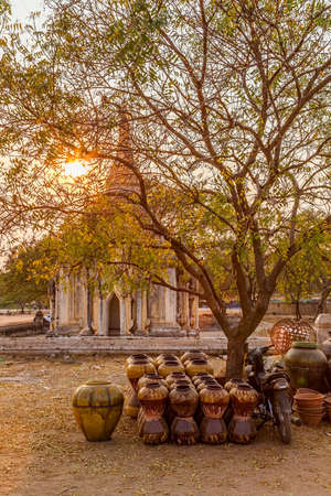 Street market with pottery in front of Bagan ancient stupa, Myanmar.の写真素材