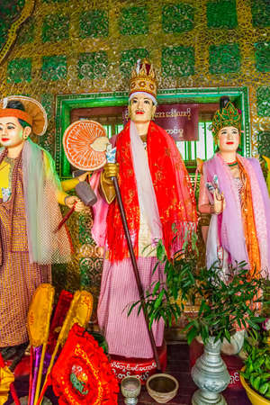MOUNT POPA, MYANMAR - FEB 24: In the temple at the entrance of the mountain puppet and sculptures show legends about the construction of the temple at the top of the mountain on Feb 24, 2012 in Mount Popa, Myanmar.のeditorial素材