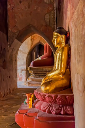 BAGAN, MYANMAR - FEBRUARY 23: Old renovated golden Buddha statue inside of Sulamani temple on February 23, 2013 in Bagan, Myanmar.のeditorial素材