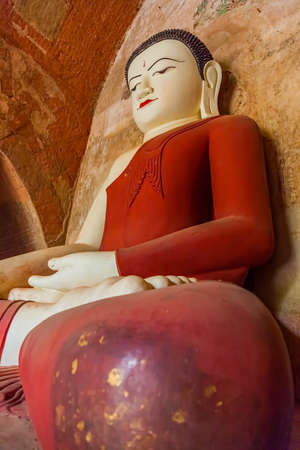 BAGAN, MYANMAR - FEBRUARY 23: Old renovated sculpture of a seated Buddha inside of Sulamani temple on February 23, 2013 in Bagan, Myanmar.のeditorial素材