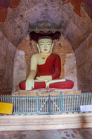 BAGAN, MYANMAR - FEBRUARY 23: Old renovated sculpture of a seated Buddha inside of Sulamani temple on February 23, 2013 in Bagan, Myanmar.のeditorial素材