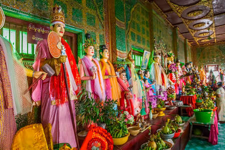 MOUNT POPA, MYANMAR - FEBRUARY 24: In the temple at the entrance of the mountain puppet and sculptures show legends about the construction of the temple at the top of the mountain on February 24, 2013 in Mount Popa, Myanmar.のeditorial素材