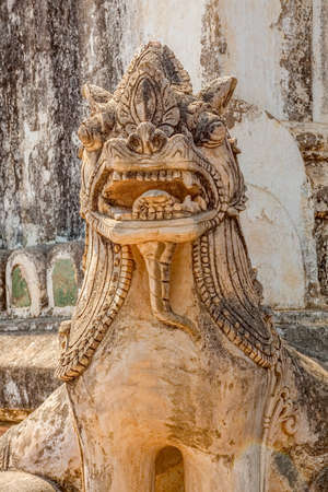 BAGAN, MYANMAR - FEBRUARY 23: Statues of the guardian Lion are positioned on every corner of ancient Ananda Temple on February 23, 2013 in Bagan, Myanmar. Built in 1105 AD during the reign of King Kyanzittha of the Pagan Dynasty.のeditorial素材