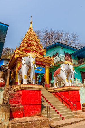 MOUNT POPA, MYANMAR - FEBRUARY 24: Decorated entrance with stairs witch lead to the temple on top of...
