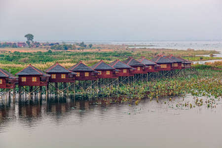 INLE LAKE, MYANMAR - FEBRUARY 28: Replica of the traditional floating village engineered as a hotel with bungalows on February 28, 2013 in Inle Lake, Myanmar.のeditorial素材