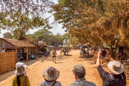 INNWA - FEBRUARY 25: Tourists waiting for their horse cart for transportation on the Ava island to visit pagodas and temples on February 25, 2013 in Innwa, Myanmar.のeditorial素材