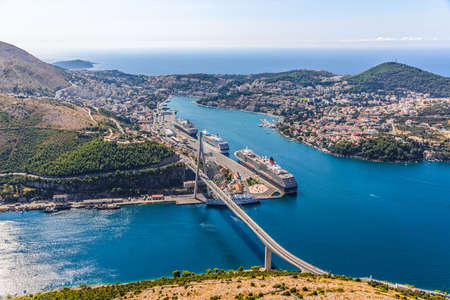 Aerial helicopter shoot of Dubrovnik bridge - entrance to the city and main harbor の写真素材