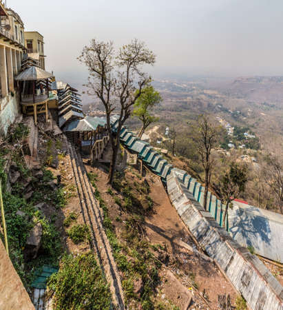 Popa Taungkalat monastery atop an outcrop of Mount Popa volcano, Myanmar  Covered trail for pilgrimsの写真素材