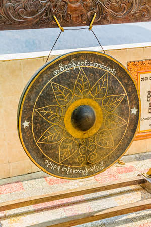 Ancient gong in Popa Taungkalat monastery atop an outcrop of Mount Popa volcano, Myanmar の写真素材