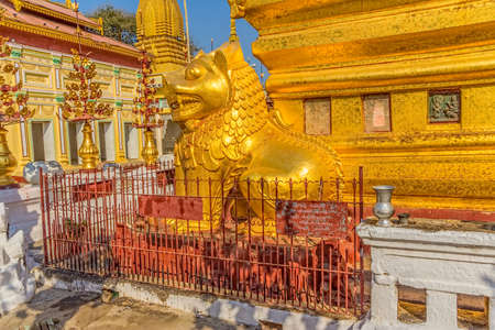 NZAUNG-U, MYANMAR - FEBRUARY 22: Golden lion decoration detail in front of the Shwezigon Pagoda on February 22, 2013 in Nyaung-U, Myanmar. Shwezigon was built A.D 1076 as the most important reliquary shrine in Bagan.のeditorial素材