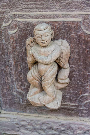 MANDALAY - FEBRUARY 26: Carving detail on the facade of Shwenandaw Kyaung Temple or Golden Palace Monastery on February 26, 2013 in Mandalay, Myanmar. Originaly gilded when was built in 1880のeditorial素材