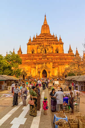BAGAN, MYANMAR - FEBRUARY 23: Main entrance of the Sulamani temple  at sunset with lot of tourists sightseeing on February 23, 2013 in Bagan, Myanmar.のeditorial素材