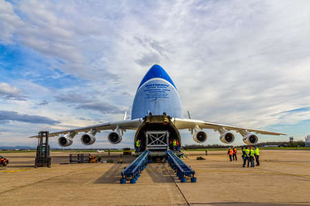 ZAGREB, CROATIA - NOVEMBER 10: Loading heavy weight cargo to the Antonov 225 Mriya airplane on November 10, 2013 Zagreb, Croatia. It is the biggest airplane in the world.のeditorial素材