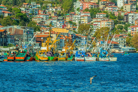 ISTANBUL, TURKEY - SEPTEMBER 28: Fishing boats moored in the small fishing harbor Sariyer on...