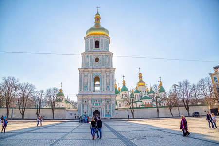 KIEV, UKRAINE - MARCH 22, 2014: People sightseeing Saint Sophia Cathedral tower at Sofiiska square.のeditorial素材