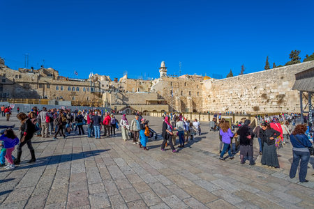 JERUSALEM, ISRAEL - FEBRUARY 28, 2014: Tourists and prayers visiting and making their wishes at The...