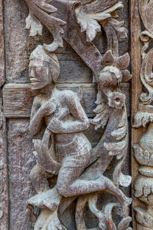 MANDALAY, MYANMAR - FEBRUARY 26, 2013: Wood carving at Shwenandaw Kyang Monastery. This is the only building that remains of the old Mandalay Palace which burnt down during World War II.のeditorial素材