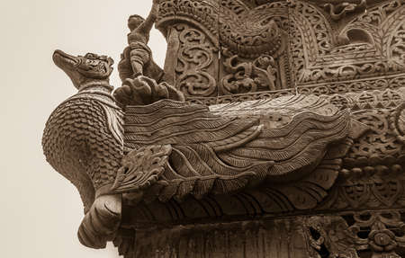 MANDALAY, MYANMAR - FEBRUARY 26, 2013: Wood carving at Shwenandaw Kyang Monastery. This is the only building that remains of the old Mandalay Palace which burnt down during World War II.のeditorial素材