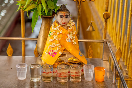 YANGON, MYANMAR - MARCH 1, 2013: Praying place with small Buddha statues in the Chaukhtatgyi temple.