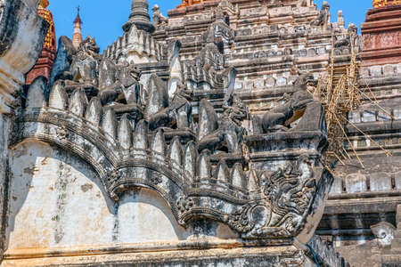 BAGAN, MYANMAR - FEBRUARY 22, 2013: Restoration of ancient Ananda Temple with bamboo scaffolding in background leading to the top. Built in 1105 AD during the reign of King Kyanzittha of the Pagan Dynasty.のeditorial素材
