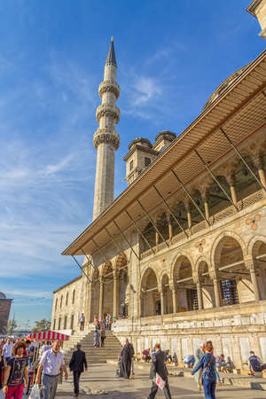 ISTANBUL, TURKEY - SEPTEMBER 26, 2013: Tourists and passers-by in the square in front of the New Mosque (Yeni Cami) in the Eminonu district.のeditorial素材