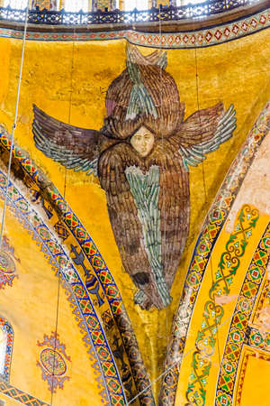 ISTANBUL, TURKEY - SEPTEMBER 27, 2013: Ceiling painted angel in Hagia Sophia ancient basilica. Hagia Sophia served as a model for many other Ottoman mosques.のeditorial素材