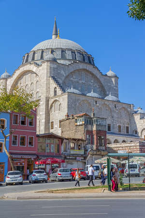 ISTANBUL, TURKEY - SEPTEMBER 28, 2013: People and cars on the road in front of the Mihrimah Sultan Mosque in Istanbul.のeditorial素材