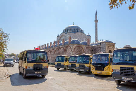 ISTANBUL, TURKEY - SEPTEMBER 28, 2013: City buses parked on the turnpike near the Mihrimah Sultan Mosque in Istanbul.のeditorial素材