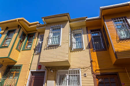 ISTANBUL, TURKEY - SEPTEMBER 28, 2013: Street with typical old wooden traditional houses and filigree sidewalk in the od part of district Fatih.のeditorial素材