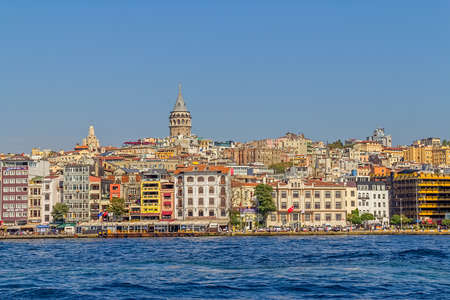 ISTANBUL, TURKEY - SEPTEMBER 29, 2013: Looking towards the Beyoglu district and Galata Tower from the boat.のeditorial素材