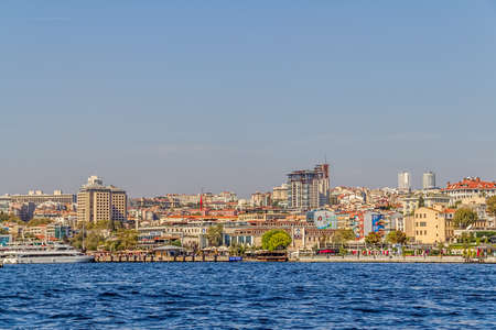 ISTANBUL, TURKEY - SEPTEMBER 29, 2013: View of the Besiktas Iskelesi and residental buildings sailing Bosporus.のeditorial素材