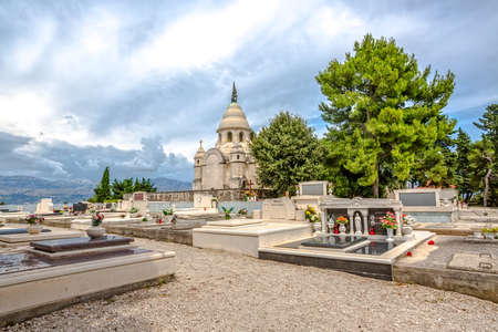 SUPETAR, CROATIA - July 23, 2014 Old traditional cemetery with mausoleum family Petrinovic in small town on island Brac Croatia.のeditorial素材
