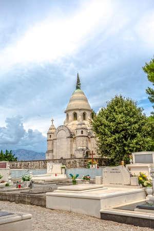 SUPETAR, CROATIA - July 23, 2014 Old traditional cemetery with mausoleum family Petrinovic in small town on island Brac Croatia.のeditorial素材