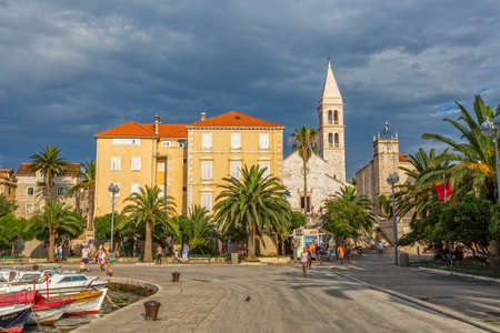 SUPETAR, CROATIA - July 23, 2014 People walking around the old town by the sea in the summer day on island Brac.のeditorial素材