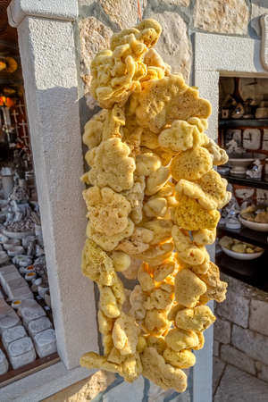 Dried sea sponges are sold to tourists and locals. It serves as an eco product for gentle skin peeling, beauty treatments, all kinds of cleaning and washing, artistic wall painting.の写真素材