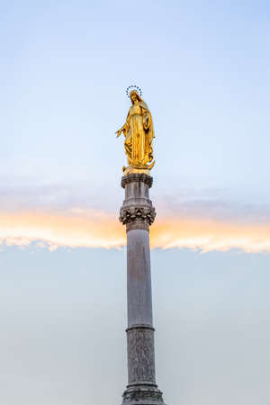 Golden statue of Virgin Mary in sunset in the Upper town Zagreb Croatia.の写真素材