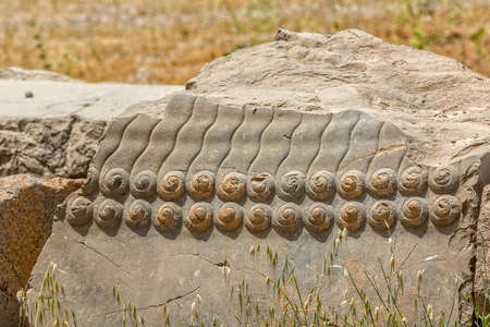 Stone detail of the old wall of the ruins of old city Persepolis.の写真素材