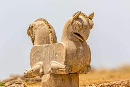 Sculpture of a Homa Bird in Persepolis, Iran. Two eagle-griffin capital has given the inspiration for the logo of Iran's National Airline Homa.の写真素材