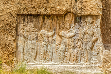 Ancient relief of the necropolis Naqsh-e Rustam near ruins of Persepolis.の写真素材