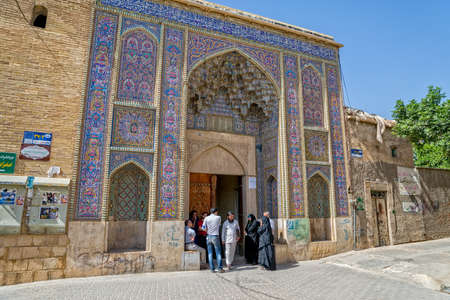 SHIRAZ, IRAN - MAY 2, 2015: Visitors talking at the entrance to the Nasir al-Mulk Mosque is a traditional mosque located in Goad-e-Araban place.のeditorial素材